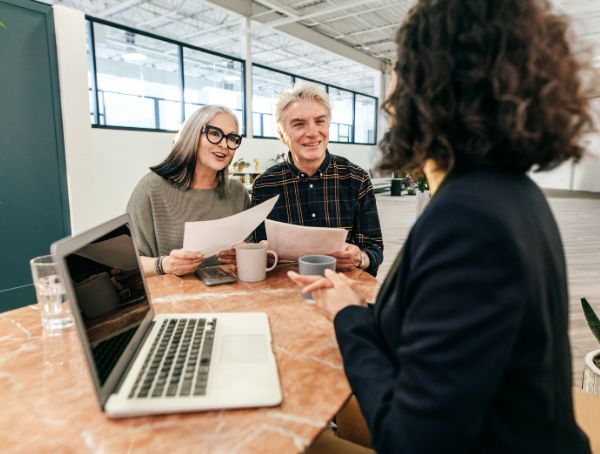 Elderly couple consulting a life insurance representative